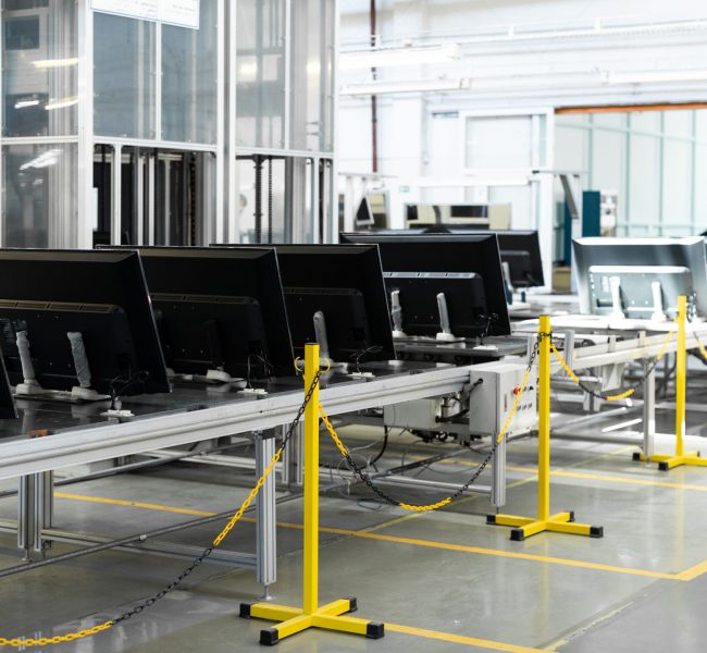 Conveyor for the production of television sets. Testing TVs in the workshop. Electronics Assembly Line